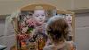 Little girl looking in dressing table mirror