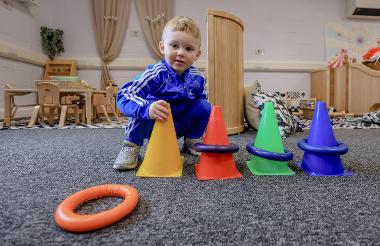 Little boy with cones and rings
